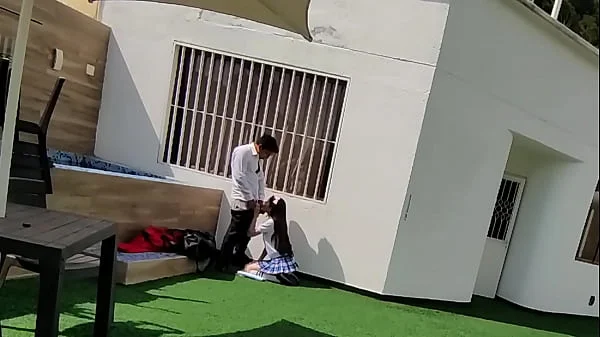 Young schoolboys have sex on the school terrace and are caught on a security camera.