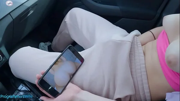 Teen masturbates on a public car park watching her porn video - ProgrammersWife